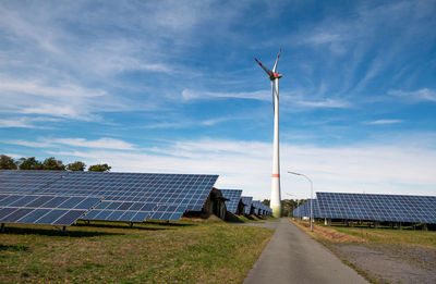 Wind turbines against sky