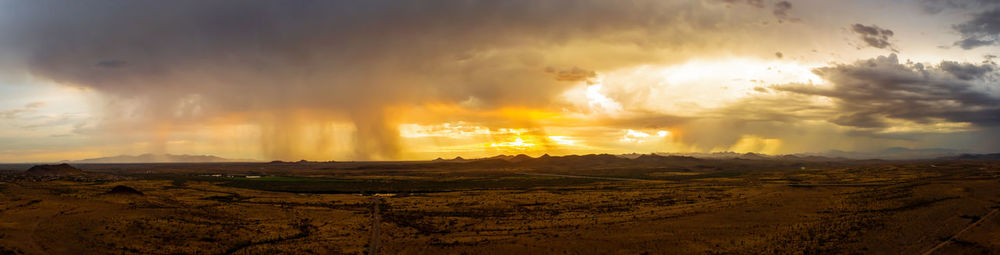 Scenic view of dramatic sky during sunset
