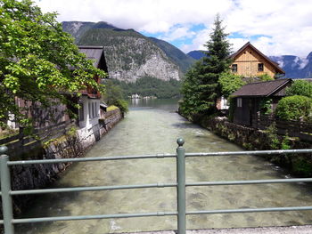 Bridge over river against mountains