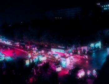 Defocused image of illuminated city at night