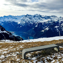 Scenic view of snowcapped mountains against sky