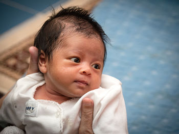 Cropped image of person holding cute baby