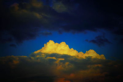 Low angle view of cloudy sky at night