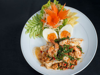 High angle view of vegetables in plate on table