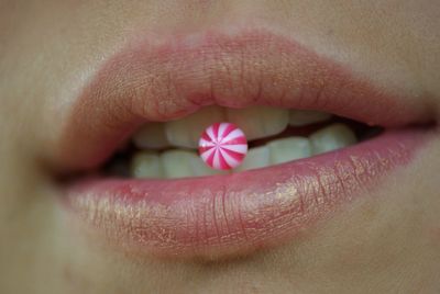 Close-up of woman holding candy