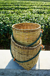 Close-up of wicker basket on field