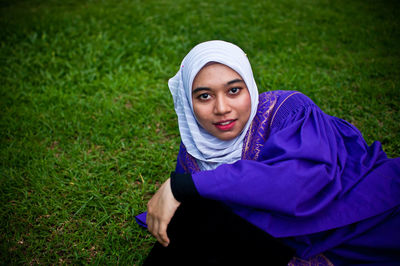 Portrait of a smiling young woman in field