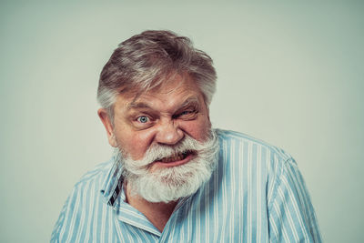 Portrait of man against white background