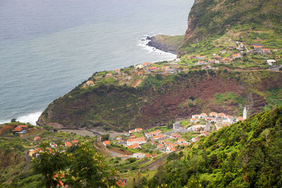 High angle view of town by sea