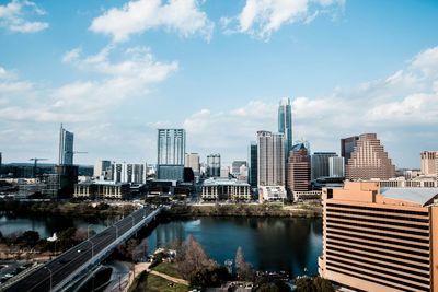 Modern buildings in city against sky