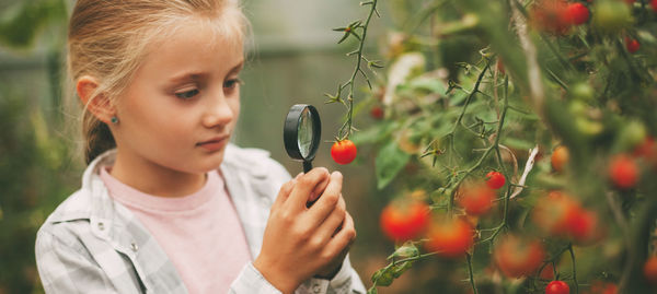 Cute girl holding plants