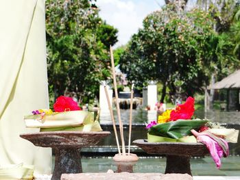 Religious offerings and incense sticks at temple