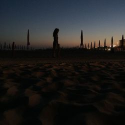 People on beach at sunset