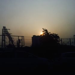 Silhouette of road against sky during sunset