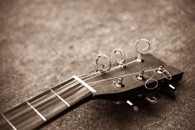 Close-up of guitar on table