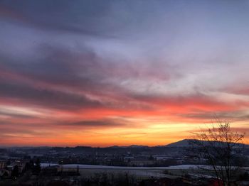 Townscape against sky during sunset