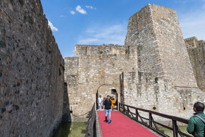 People on the wall of a building