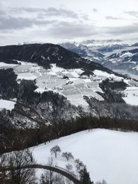 Scenic view of snow covered mountains against sky