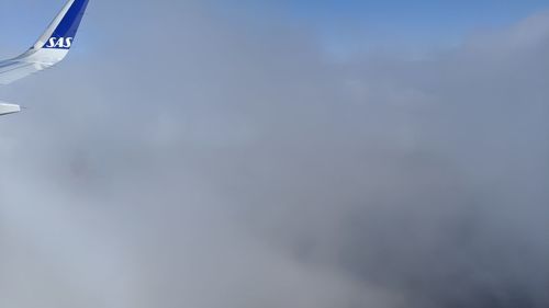 Low angle view of airplane flying in sky