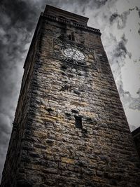 Low angle view of clock tower against sky