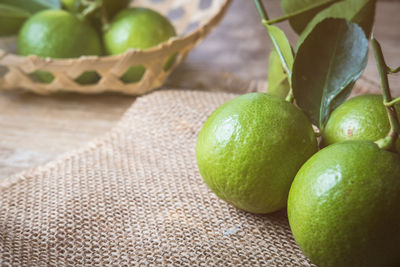 Close-up of green fruits on table