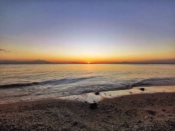 Scenic view of sea against clear sky during sunset