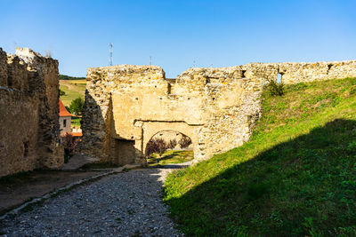 Old ruins against clear blue sky