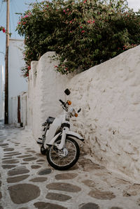 View of motorcycle in alley amidst houses