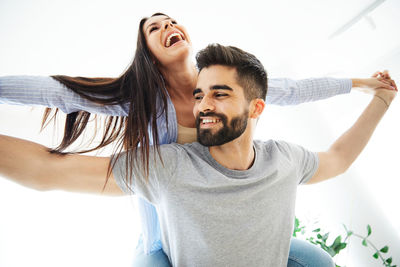 Portrait of happy young couple