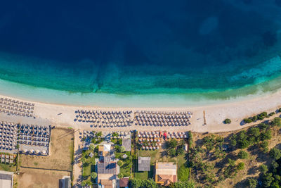 High angle view of buildings by sea against sky