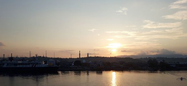 View of harbor at sunset