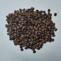 High angle view of coffee beans against white background