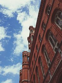 Low angle view of building against cloudy sky