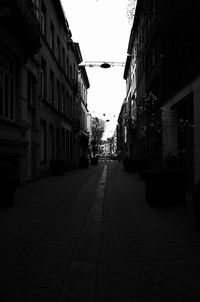 Narrow alley amidst buildings in city