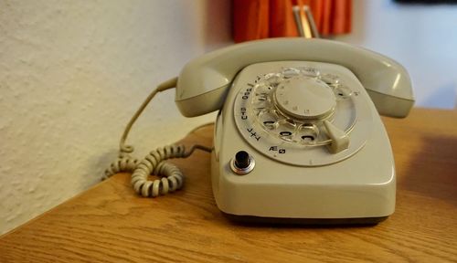 Close-up of telephone on table