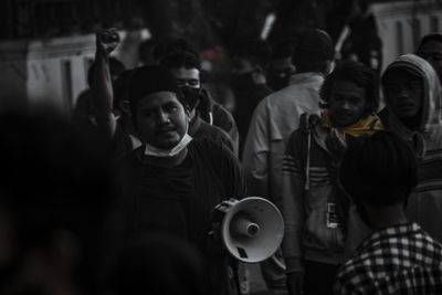 People standing on street in city