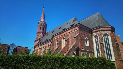 Low angle view of historic church against clear sky