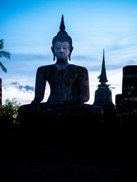 Statue of historic building against sky