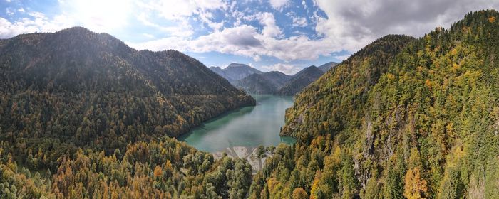 Panoramic view of lake and mountains against sky