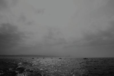 Scenic view of sea against cloudy sky