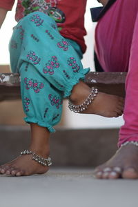 Low section of women standing on floor