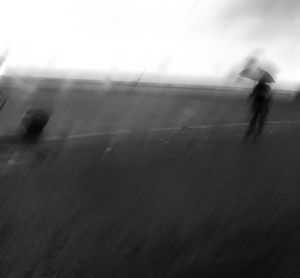 Blurred motion of man against the sky