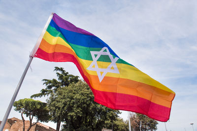 Low angle view of flag against sky