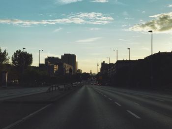 Road in city against sky