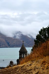 Sevan, armenia - church by sea against sky