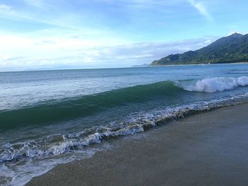 Scenic view of beach and sea against sky