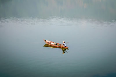 High angle view of man on boat in lake