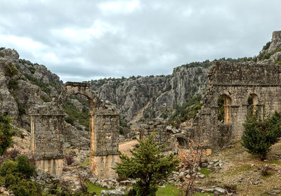 View of old ruins against cloudy sky