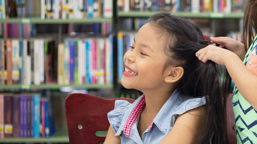 Portrait of a girl reading book