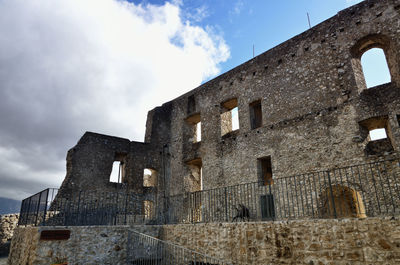 Low angle view of old building against sky